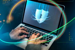 Person typing on a laptop keyboard with an animated lock screen render animated.